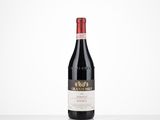 a bottle of red wine sitting on top of a table