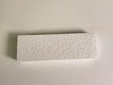 a piece of white paper on a white surface