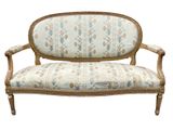 an image of a couch with a floral upholstered back