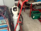 a garage with a lot of tools and equipment in it