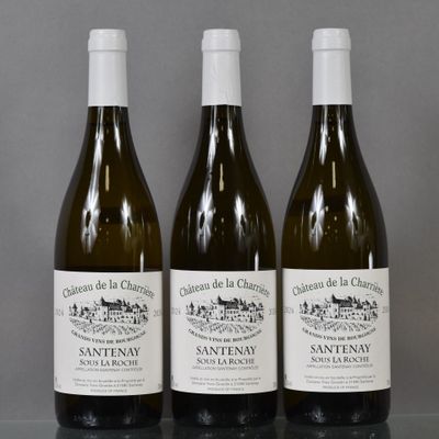 three bottles of wine sitting on top of a table next to each other
