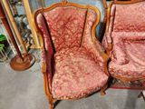 two chairs sitting next to each other in a room