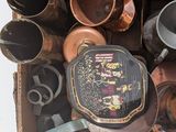 a box full of pots and pans sitting on top of a table