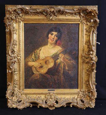 un vieux tableau représentant une femme tenant une guitare, dans un cadre doré