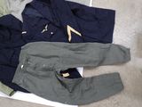 three pieces of clothing that are laying on the floor