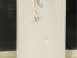 an image of a white water heater on the floor