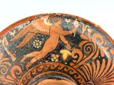 a close up of a vase with an image of a bird on it