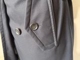 a close up of a person ' s pants with buttons on them