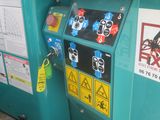 a blue machine that has stickers on the side of it