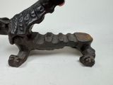 a small statue of a dog on a skateboard