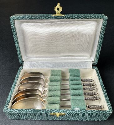 a set of six silverplated spoons and spoons in a green case