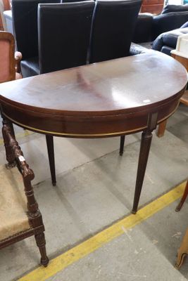 a table and chairs in a room with a lot of furniture
