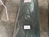 a large roll of plastic sitting on the floor