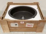 a wooden box with a black sink inside of it