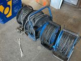 a blue cart with a bunch of wires on the floor