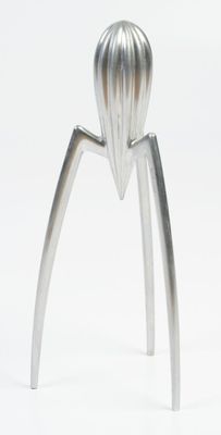 a stainless steel juicer that is on a white surface