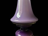 a purple lamp that is sitting on a table