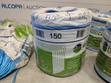 several rolls of blue and white electrical wire are on a table