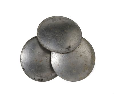 a pile of metal buttons sitting on top of each other