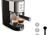 an image of a coffee machine with a cup of espressor in front of it