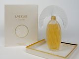 an image of a bottle of perfume on a tray