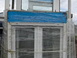 a large window that has been wrapped up and is sitting on a pallet