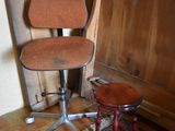 a chair that is sitting next to a small table