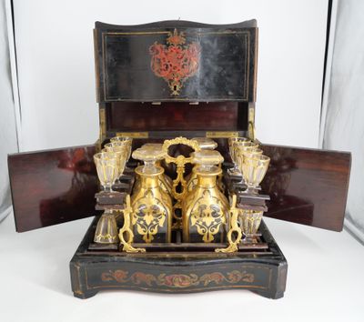 a wooden box that has a bunch of vases inside of it