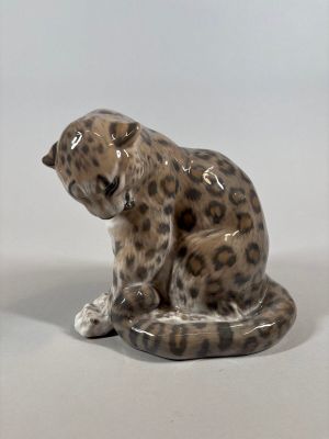 ceramic figurine of a leopard sitting on its hind legs