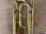 a brass instrument that is laying on the floor