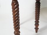 a wooden table with a marble top on it