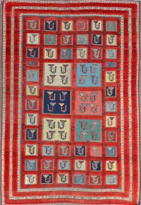 a red and blue rug with many different designs on it