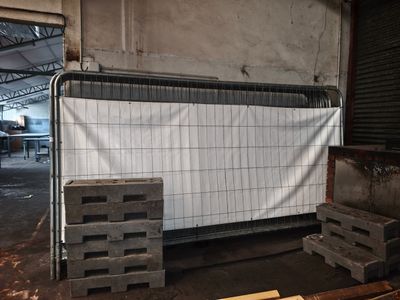a room that has a lot of pallets on the floor