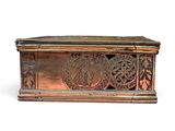 a wooden box with carvings on it on a white surface