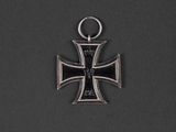 an image of a silver cross with a black cross on it