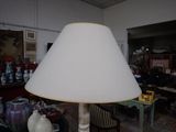 a lamp that is sitting on a table in a room