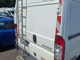 a white van that is parked in a parking lot