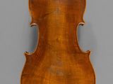an old violin with a wooden back and a long neck