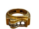 a gold ring with diamonds on it on a white background