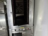 an oven that is sitting in the corner of a kitchen