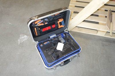 a tool case with tools inside of it on the floor
