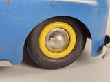 a blue toy car with a yellow rim on it