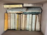 a box full of books that are sitting on top of each other
