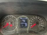 a close up of a car dashboard with a speedometer and gauges