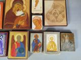 a lot of small wooden blocks with religious images on them