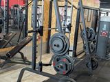 an image of a gym area with a weight machine