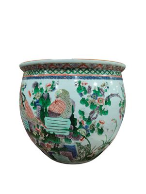 an image of a vase with a woman sitting on a bench in a garden