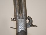 a close up of a gun on a wall with a white background