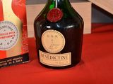 a bottle of wine sitting next to a box of wine