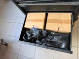 two boxes that are sitting inside of a drawer